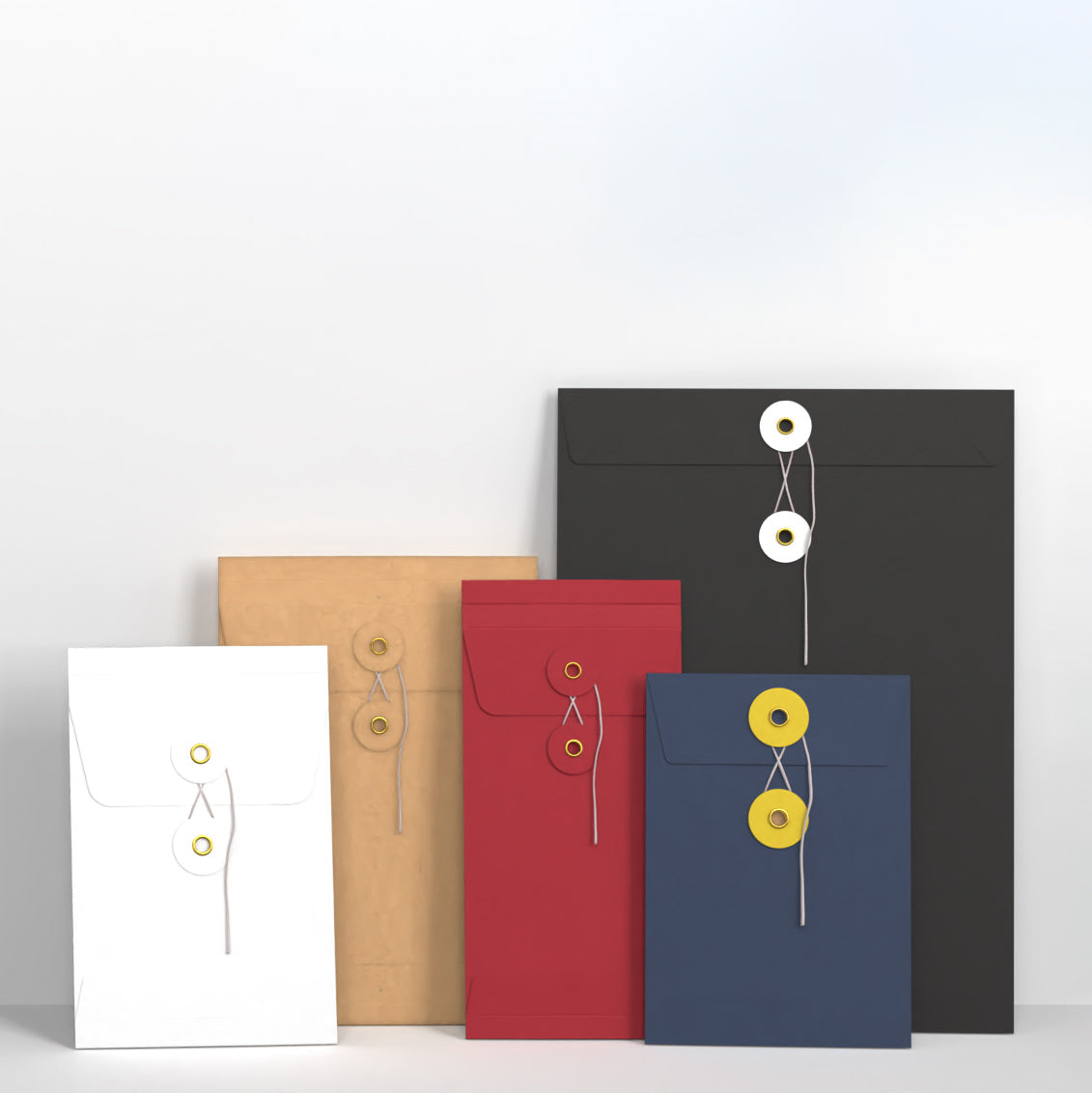 Five colorful envelopes with button closures on a white background