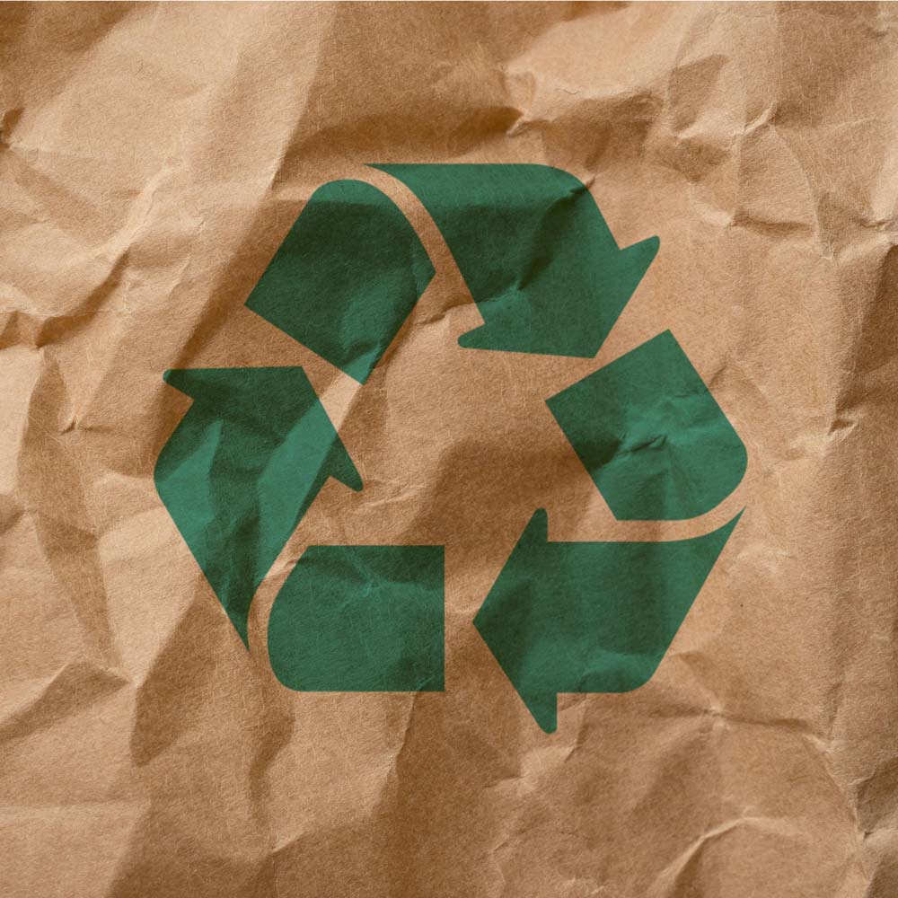 Recycling symbol on crumpled brown paper